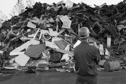 Construction site with waste being cleared by professionals